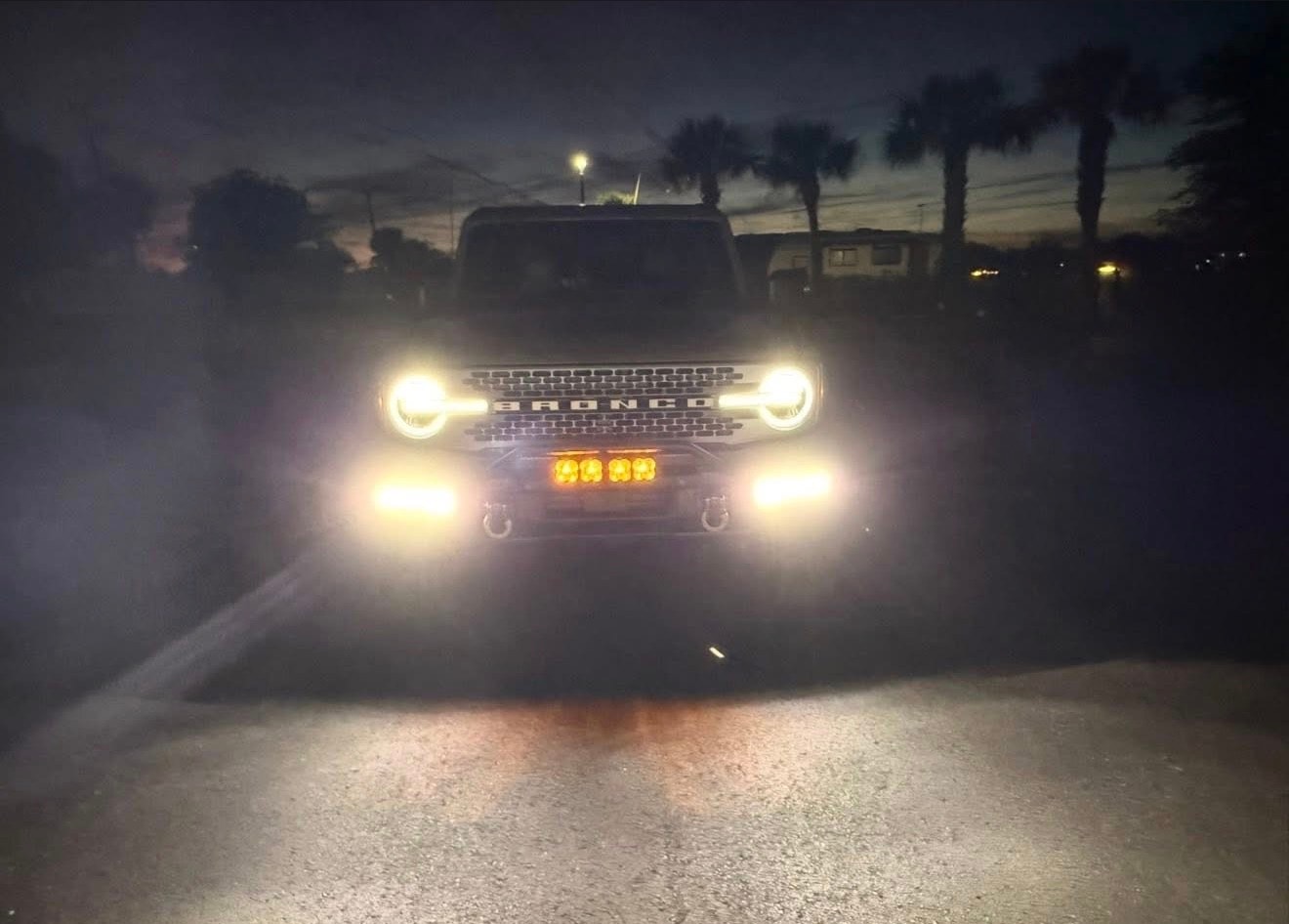 Custom automotive lighting - Ford Bronco with halo headlights at night